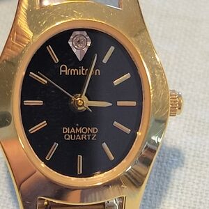 Vintage,Armitron Gold-Tone Bracelet Watch with Black Dial and Diamond Accent.